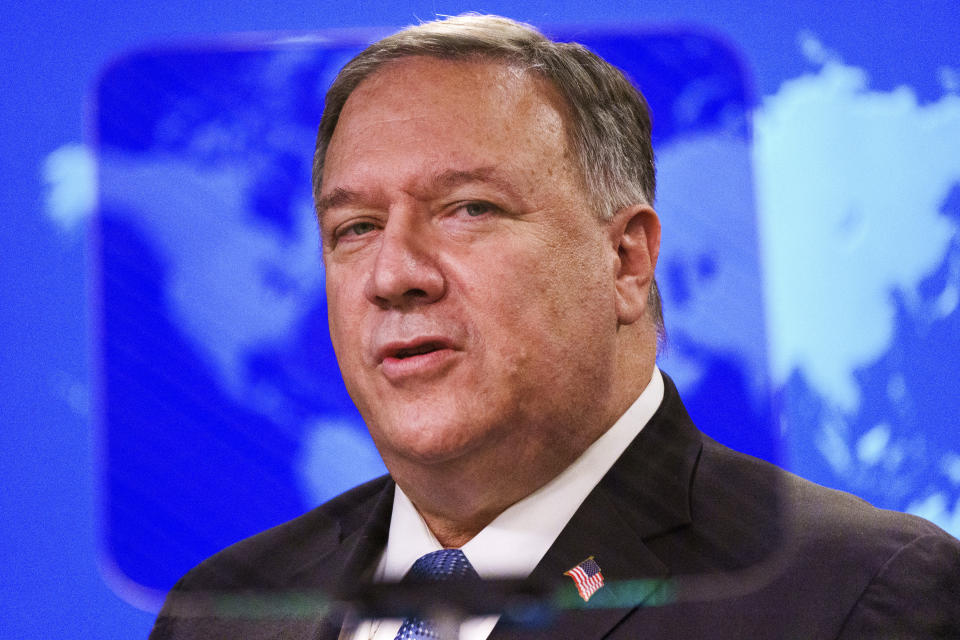 Secretary of State Mike Pompeo is seen through a teleprompter screen as he gives a briefing to the media, Tuesday, Nov. 10, 2020, at the State Department in Washington. (AP Photo/Jacquelyn Martin, Pool)