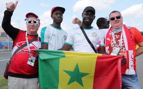 Russian, Senegalese and Polish football fans  - Credit: TASS