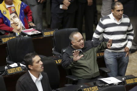 Diosdado Cabello (C), deputy of Venezuela's United Socialist Party (PSUV), gestures during a session of the National Assembly in Caracas, January 13, 2016. REUTERS/Marco Bello