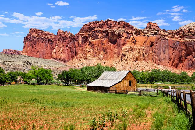 <p>jenifoto/Getty Images</p> Fruita Barn in Capitol Reef National Park.