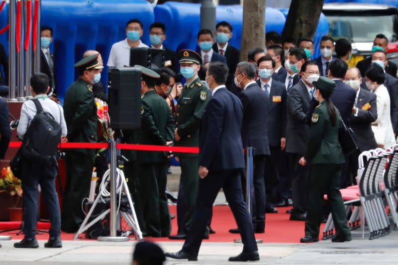 People's Liberation Army officers attend the opening ceremony of temporary national security office, in Hong Kong