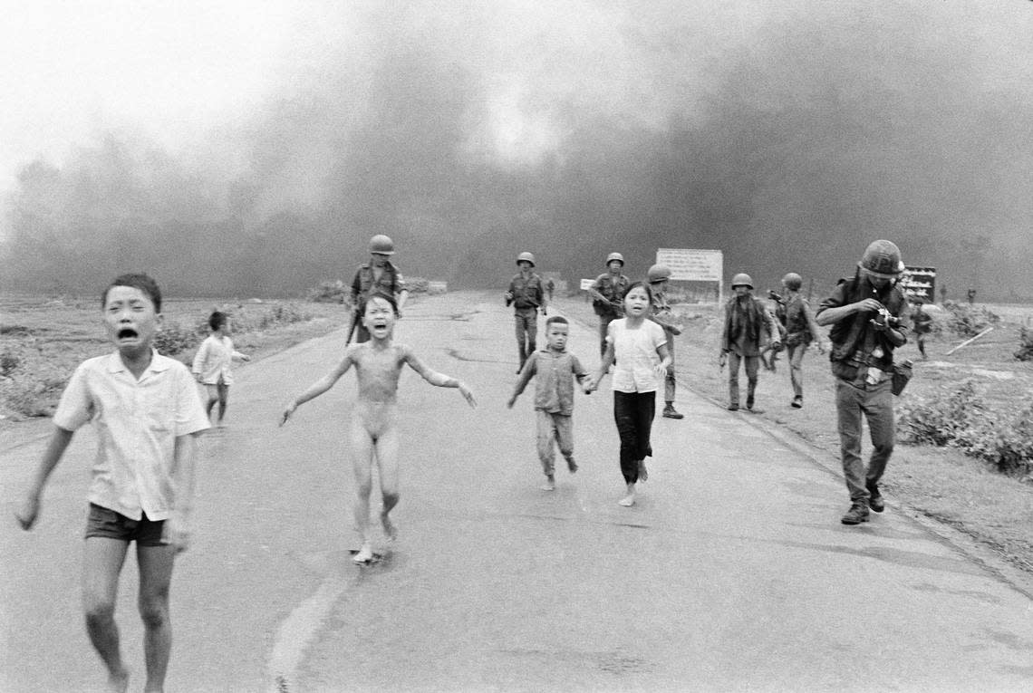 Photojournalist Nick Ut was awarded the 1973 Pulitzer Price for his photo of South Vietnamese forces following terrified children, including 9-year-old Kim Phuc, center, as they run down Route 1 near Trang Bang after an aerial napalm attack on suspected Viet Cong hiding places, June 8, 1972. A South Vietnamese plane accidentally dropped its flaming napalm on South Vietnamese troops and civilians. The terrified girl had ripped off her burning clothes while fleeing. 