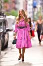 <p>It's all so very Carrie! On another day of shooting And Just Like That on July 19 in the NoHo area of New York City, Parker wore a Carolina Herrera pink ruffled-hem shirt midi dress cinched at the waist with a vintage belt <a href="https://www.instagram.com/p/CRhdHGZNS2X/" rel="nofollow noopener" target="_blank" data-ylk="slk:which the most diligent SATC fans will recognise from the first movie.;elm:context_link;itc:0;sec:content-canvas" class="link ">which the most diligent SATC fans will recognise from the first movie. </a></p><p>In classic Carrie fashion, she's wearing vintage Manolo Blahnik heels. </p>