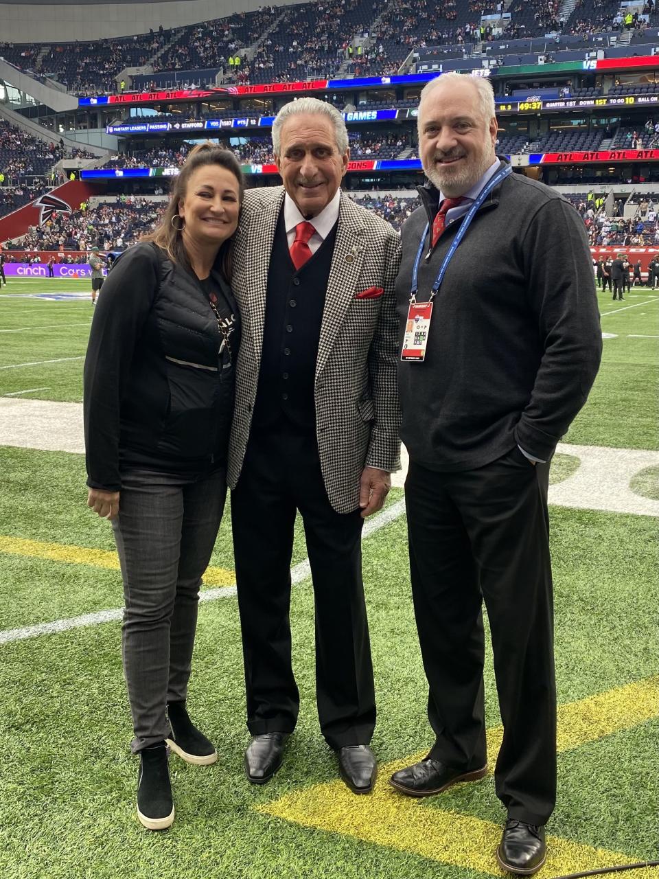 Melissa Jewkes, left, and Brett Jewkes, right, pose with Arthur Blank. | Courtesy Brett Jewkes