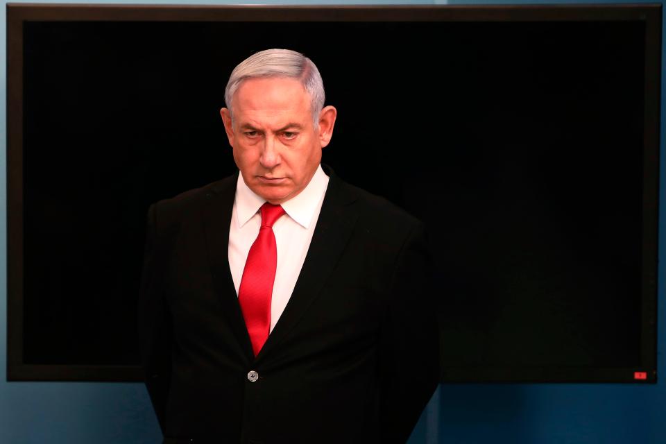 Israeli Prime Minister Benjamin Netanyahu arrives for a speech from his Jerusalem office March 14, 2020, saying Israel's restaurants and places of entertainment will be closed to stop the spread of the coronavirus.