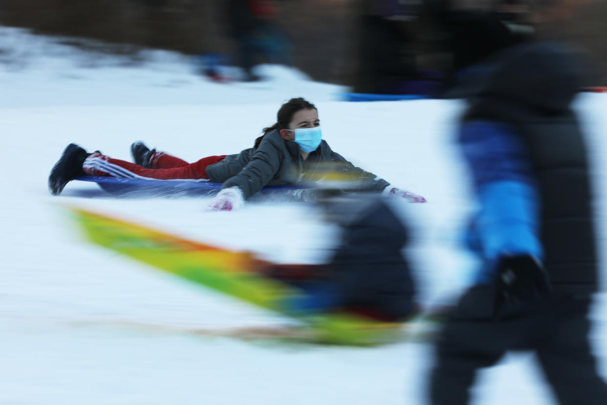 People enjoy an afternoon of sledding at New York's Central Park on Thursday.