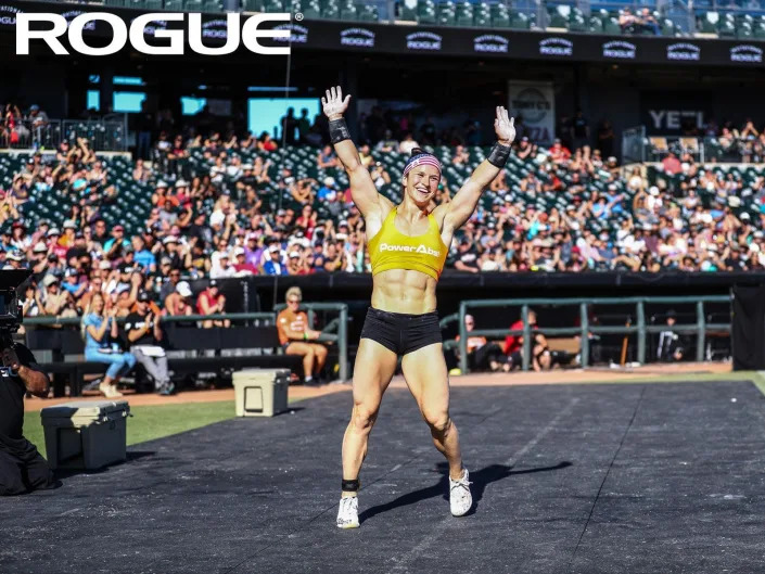 CrossFit athlete Kari Pearce waves to the crowd at competition