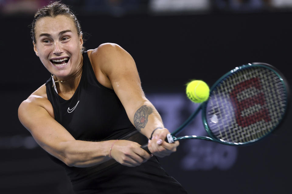 FILE - Aryna Sabalenka of Belarus plays a shot in her quarterfinal match against Daria Kasatkina of Russia during the Brisbane International tennis tournament in Brisbane, Australia, Friday, Jan. 5, 2024. Sabalenka is one of the players to watch at the Australian Open. The year's first Grand Slam tennis tournament is scheduled to start at Melbourne Park on Sunday, Jan. 14. (AP Photo/Tertius Pickard, Fie)