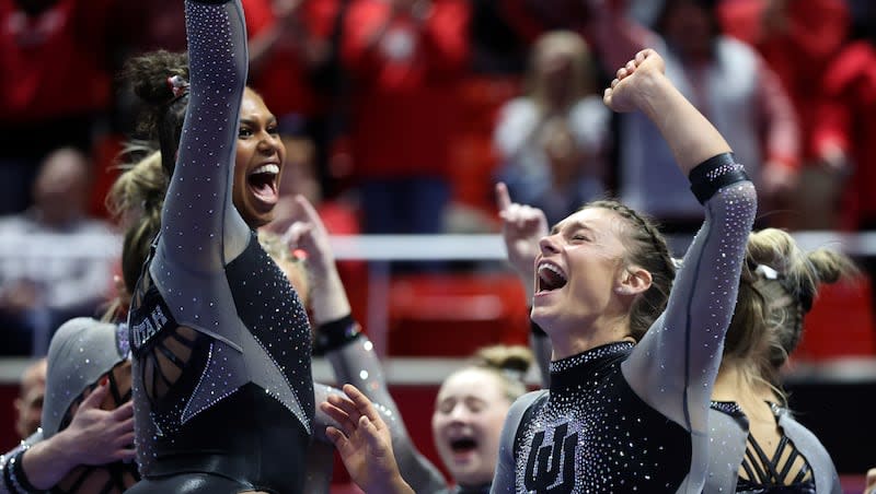 The Utah Red Rocks react to Abby Paulson scoring a perfect 10.0 beam routine while competing against Stanford and Utah State at the Huntsman Center in Salt Lake City on Friday, March 15, 2024. The Red Rocks will be in Fort Worth, Texas, competing in the NCAA championships this week.