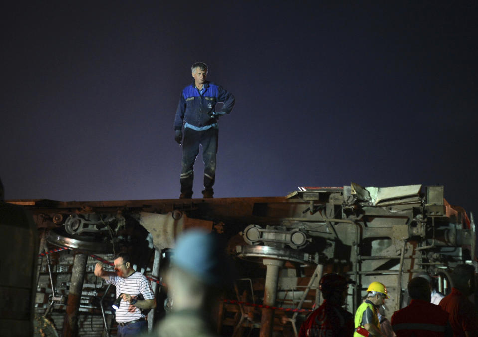 <p>Recovery officials work around overturned train cars, near a village at Tekirdag province, northwestern Turkey on July 9, 2018. (Photo: IHA via AP) </p>