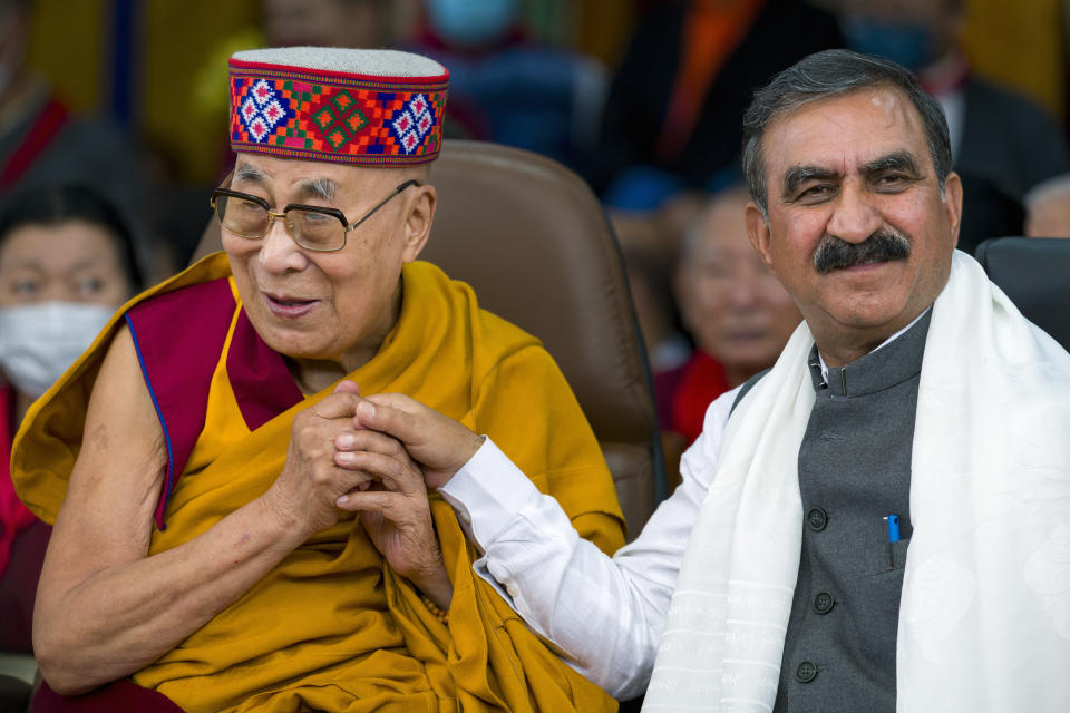 Tibetan spiritual leader the Dalai Lama holds hands with Sukhvinder Singh Sukhu, Chief Minister of Himachal Pradesh, during a function marking the 88th birthday of the Tibetan leader at the Tsuglakhang temple in Dharamshala, India, Thursday, July 6, 2023. (AP Photo/Ashwini Bhatia)