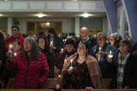 Community members gather and hold a vigil for the six people killed in a plane crash, in Fort Smith, Northwest Territories, on Wednesday, Jan. 24, 2024. (Jason Franson/The Canadian Press via AP)