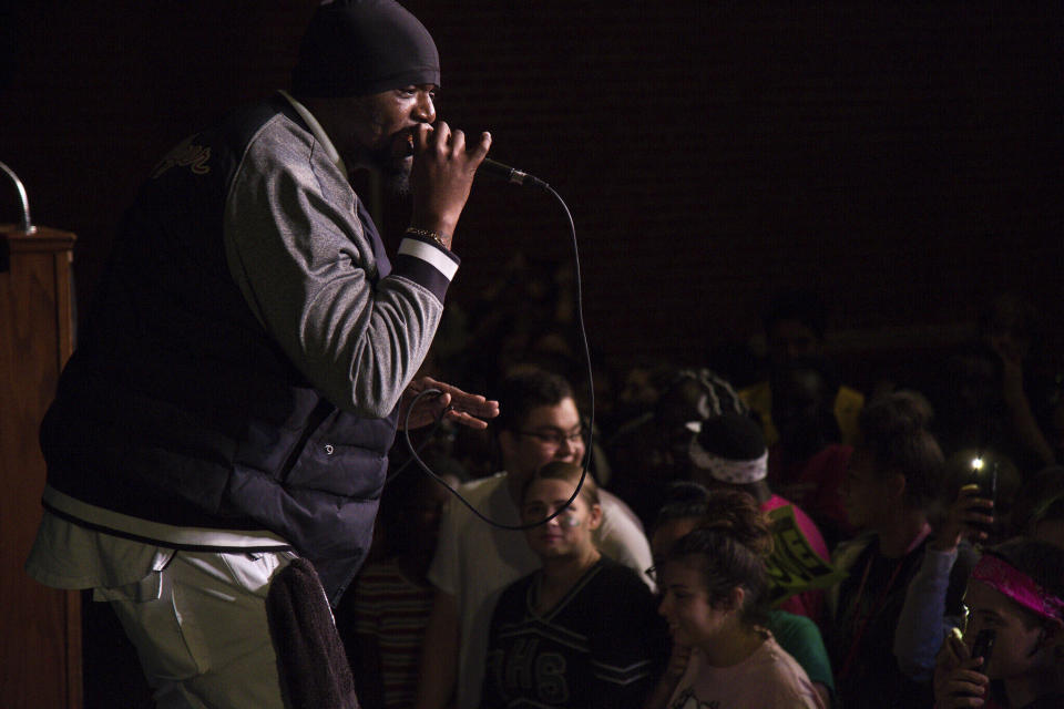 In this image provided by the Des Moines Public Schools, community activist and rap artist Will Keeps performs at North High School for students and community members on Oct. 6, 2017, in Des Moines, Iowa, prior to the Speak Up Against Violence Walk, a march organized by middle and high school students to raise awareness of gun violence in the community. Keeps is hospitalized in serious condition after surgery following just the sort of violence he's devoted his life to stop -- a shooting that killed two teenagers at the Starts Right Here educational program he founded in Des Moines. Keeps was hurt Monday, Jan. 23, 2023, when he tried to intervene. (Phil Roeder/Des Moines Public Schools via AP)