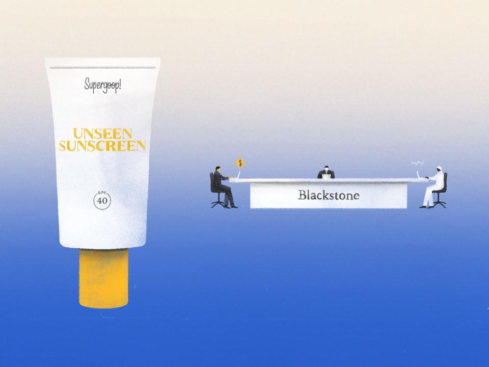 Supergoop sunscreen next to Blackstone office table with workers.