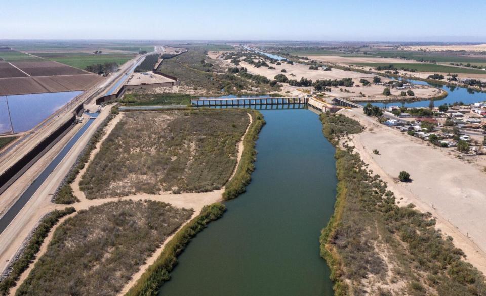 A river flows by a dam