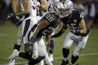 Oakland Raiders running back Josh Jacobs (28) celebrates after scoring a touchdown during the fourth quarter of an NFL football game against the Denver Broncos Monday, Sept. 9, 2019, in Oakland, Calif. At right is running back Alec Ingold (45). (AP Photo/Ben Margot)