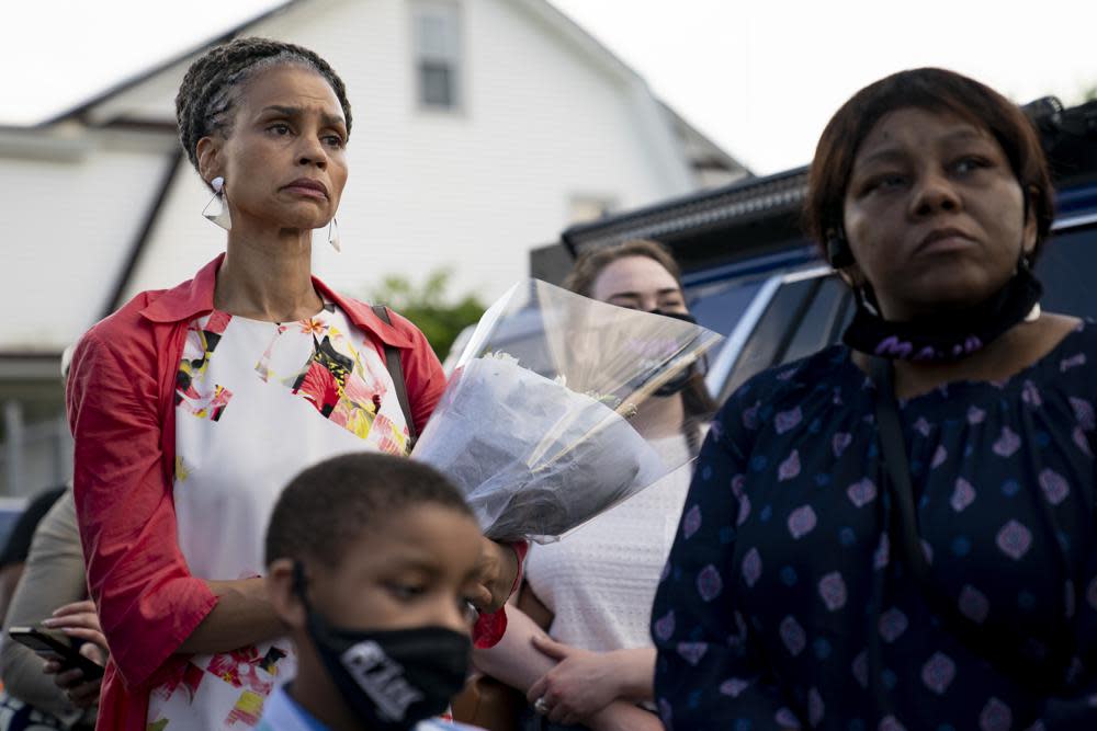 New York City mayoral candidate Maya Wiley attends a vigil at the scene where 10-year old Justin Wallace was shot and killed the previous Saturday night in the Rockaway section of the Queens borough of New York, Wednesday, June 9, 2021. (AP Photo/John Minchillo)