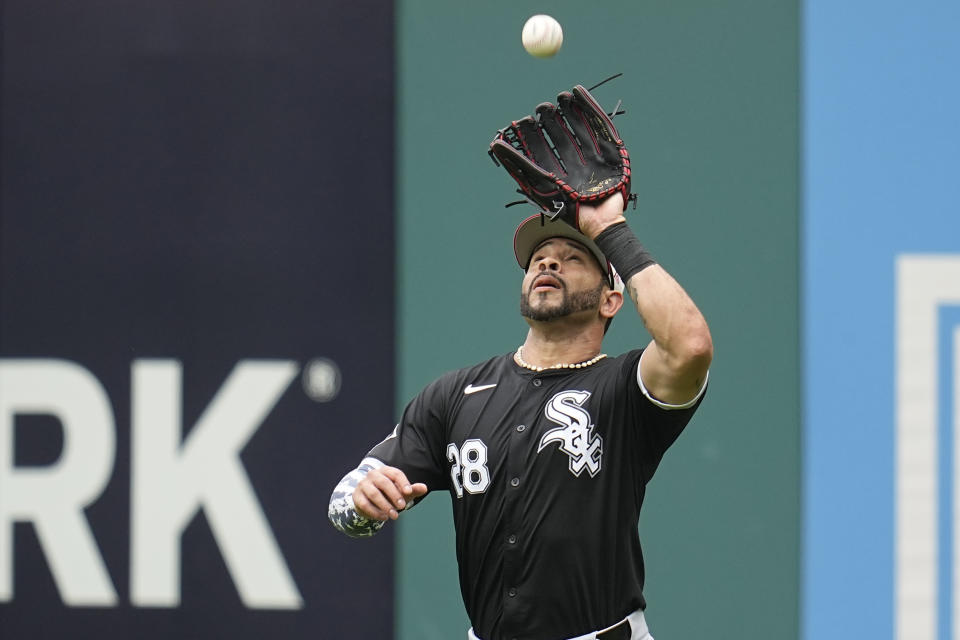 Chicago White Sox right fielder Tommy Pham catches a fly ball hit for an out by Cleveland Guardians' José Ramírez in the third inning of a baseball game Thursday, July 4, 2024, in Cleveland. (AP Photo/Sue Ogrocki)