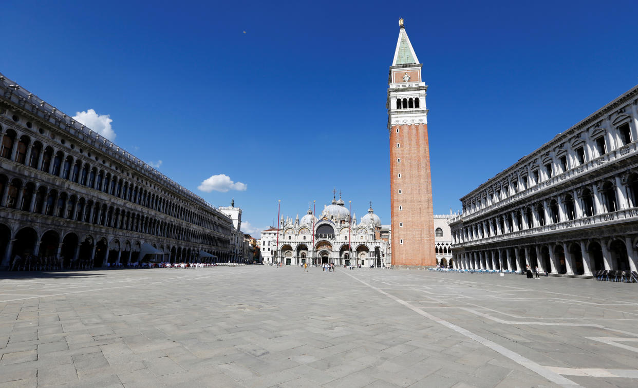 A general view shows almost empty St. Mark's Square in the afternoon, amid the coronavirus disease (COVID-19) outbreak, in Venice, Italy June 18, 2020.  REUTERS/Fabrizio Bensch