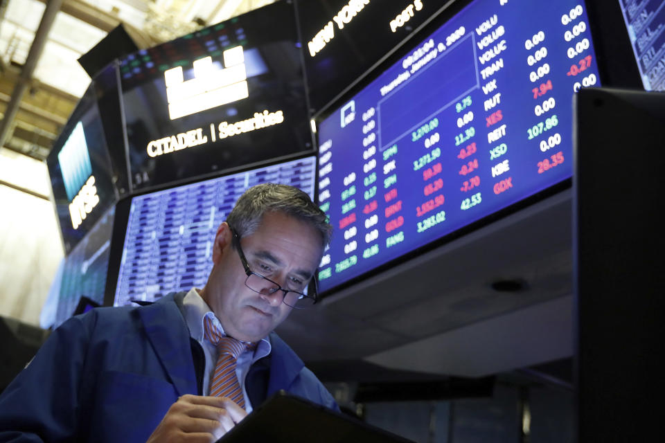 Trader Daniel Trimble works on the floor of the New York Stock Exchange, Thursday, Jan. 9, 2020. Stocks are opening broadly higher on Wall Street as traders welcome news that China's top trade official will head to Washington next week to sign a preliminary trade deal with the U.S. (AP Photo/Richard Drew)