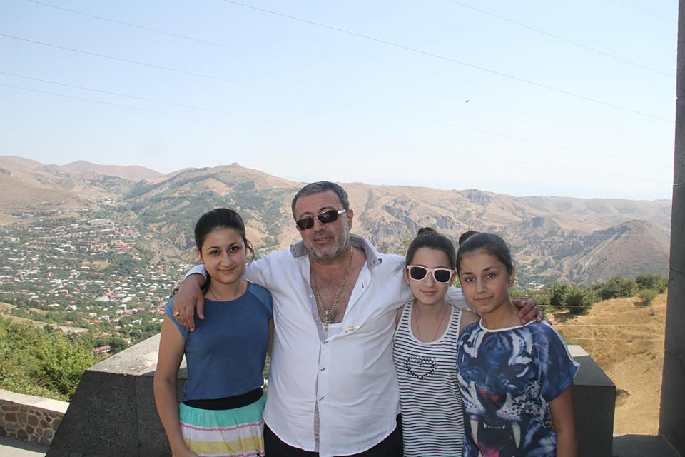 The sisters pose for a photo with their father. Source: EAST2WEST/Australscope