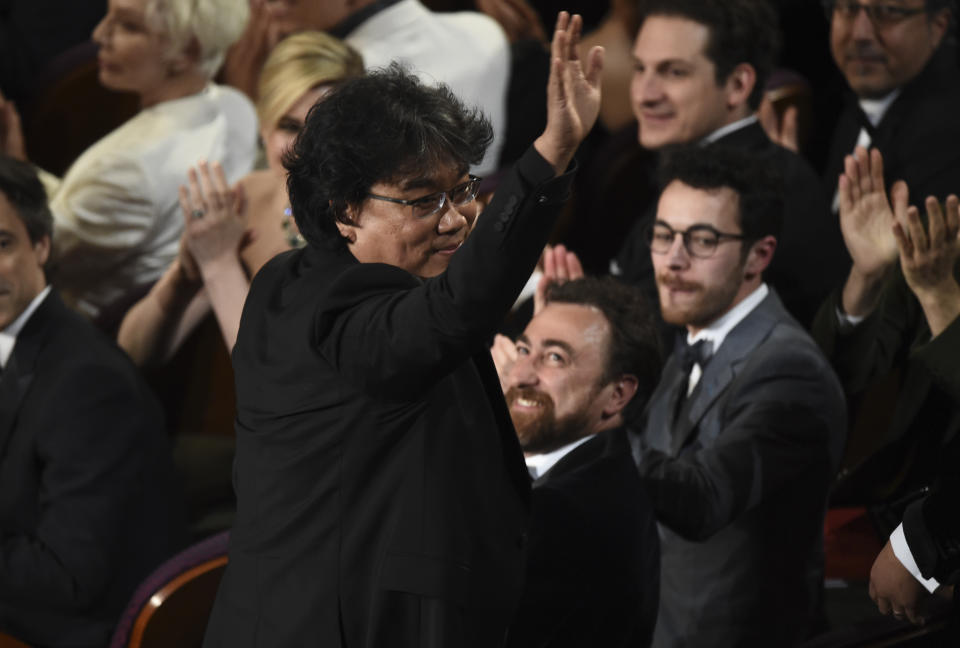 Bong Joon-ho was seen in the audience before accepting the award for best original screenplay for "Parasite" at the Oscars on Sunday, Feb. 9, 2020, at the Dolby Theatre in Los Angeles. (AP Photo/Chris Pizzello)