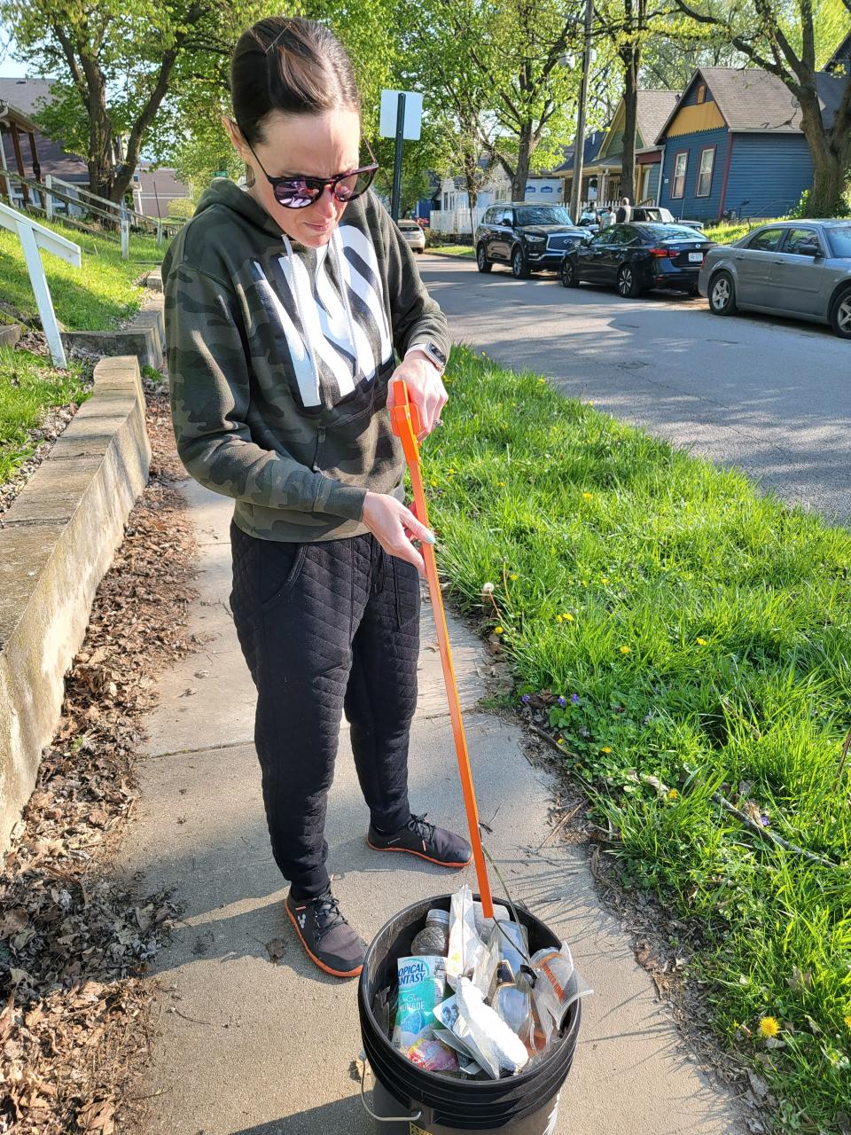 Erin James-Dolan, wife of Rachel James-Dolan, is one of the Gripper Gang's newest recruits. Here, Erin shows of a recent litter pick up on the near East side.