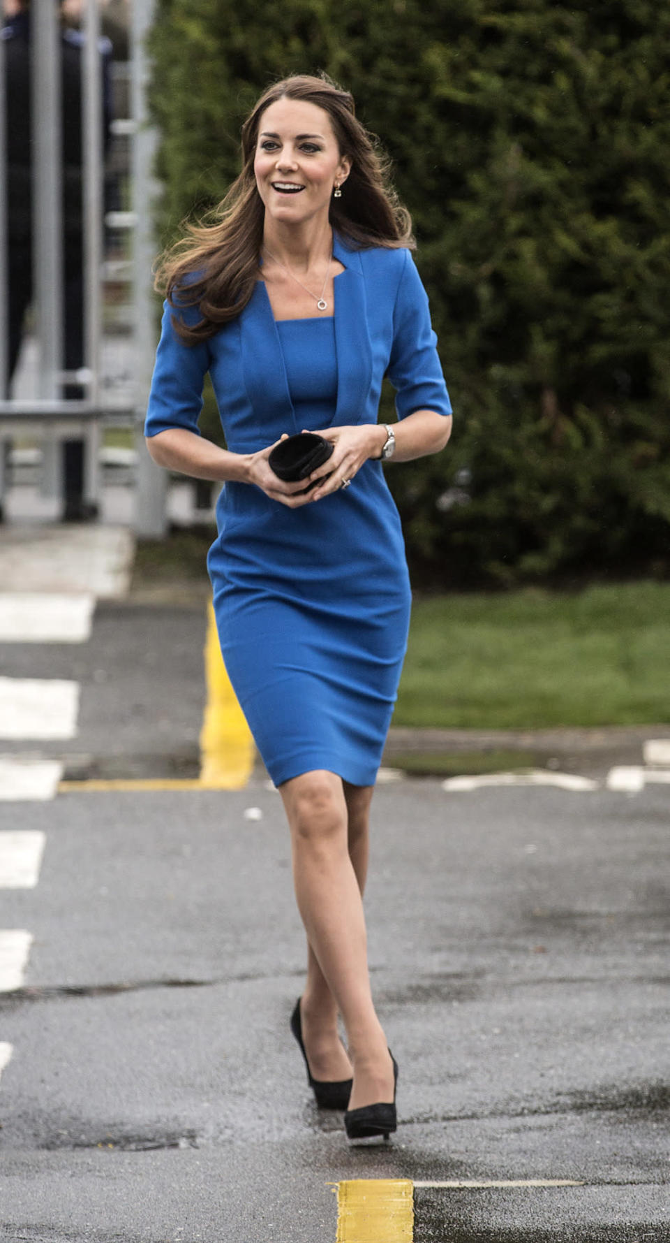 <p>For a London school event, Kate donned an all-blue fitted ensemble by L.K. Bennett with a black clutch, suede pumps and Cartier jewellery.</p><p><i>[Photo: PA]</i></p>