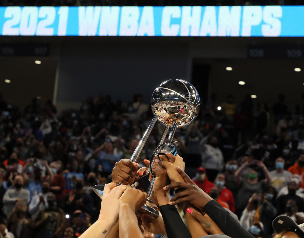 Chicago Sky players hold celebrate after winning the WNBA championship on Oct. 17, 2021, at Wintrust Arena in Chicago. (Stacey Wescott/Chicago Tribune/Tribune News Service via Getty Images)