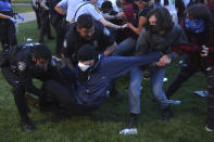 Police arrest protesters attempting to camp in support of Palestinians on Washington University's campus in St. Louis, Saturday, April 27, 2024. (Christine Tannous/St. Louis Post-Dispatch via AP)