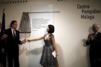 French Culture Minister Fleur Pellerin (C) and Spain's Prime Minister Mariano Rajoy (L) unveil a commemorative plaque during the opening ceremony of the Malaga branch of the Centre Pompidou in Malaga, southern Spain March 28, 2015. REUTERS/Jon Nazca