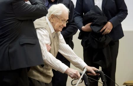 Defendant Oskar Groening, a 93-year-old former bookkeeper at Auschwitz death camp, arrives for the start of his trial in a courtroom in Lueneburg, in this file picture taken April 21, 2015. REUTERS/Julian Stratenschulte/Pool/Files