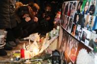 FILE PHOTO: Mourners attend an outdoor vigil for the victims of a Ukrainian passenger jet which crashed in Iran, in Toronto