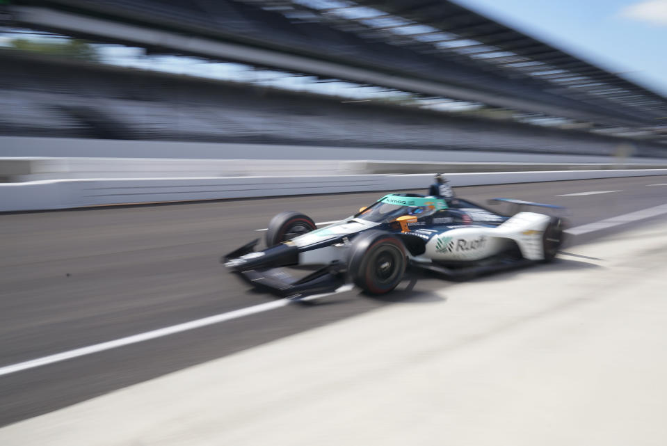 Fernando Alonso, of Spain, pulls out of the pits during a practice session for the Indianapolis 500 auto race at Indianapolis Motor Speedway, Friday, Aug. 14, 2020, in Indianapolis. (AP Photo/Darron Cummings)