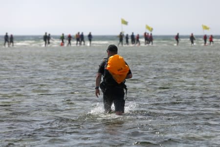 People take part in the annual event called the Herring March in Puck Bay