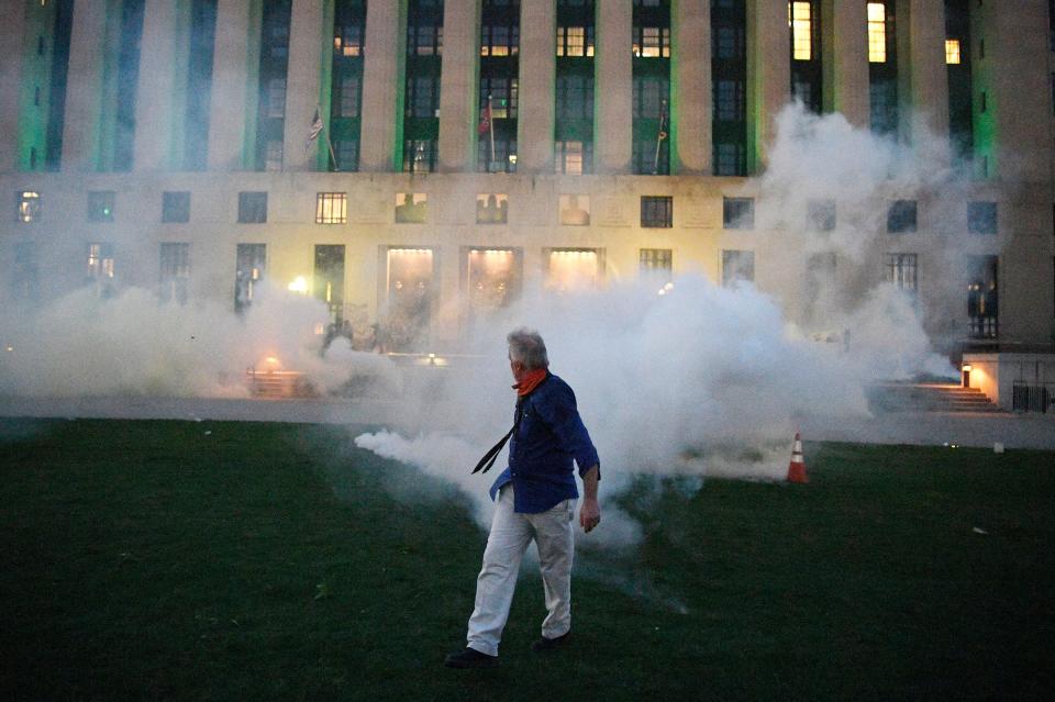 Tear gas is sprayed outside the Metro Courthouse in Nashville, Tenn., Saturday, during the “I Will Breathe” rally to protest the death of George Floyd, a black man who died after being pinned down by a white Minneapolis police officer on Memorial Day.