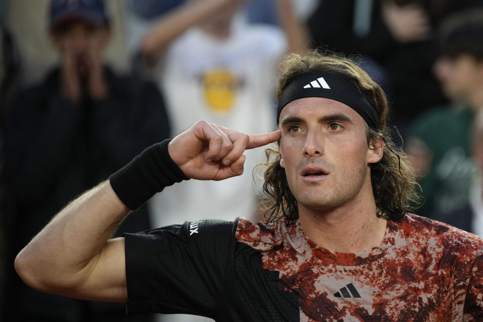 Greece's Stefanos Tsitsipas celebrates winning his fourth round match of the French Open tennis tournament against Austria's Sebastian Ofner at the Roland Garros stadium in Paris, Sunday, June 4, 2023. (AP Photo/Christophe Ena)