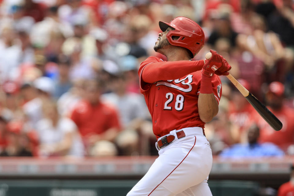 Cincinnati Reds' Tommy Pham watches an RBI sacrifice fly during the third inning of a baseball game against the St. Louis Cardinals in Cincinnati, Sunday, July 24, 2022. (AP Photo/Aaron Doster)