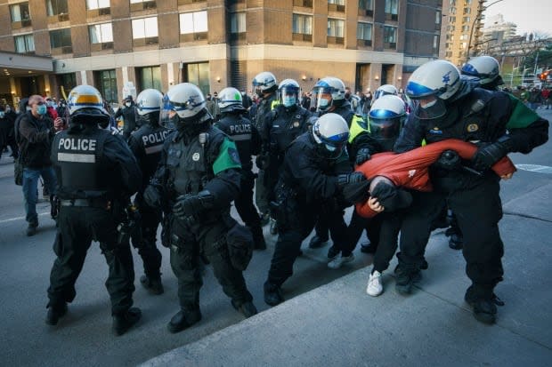 Dozens of Montreal police officers followed protesters Sunday.