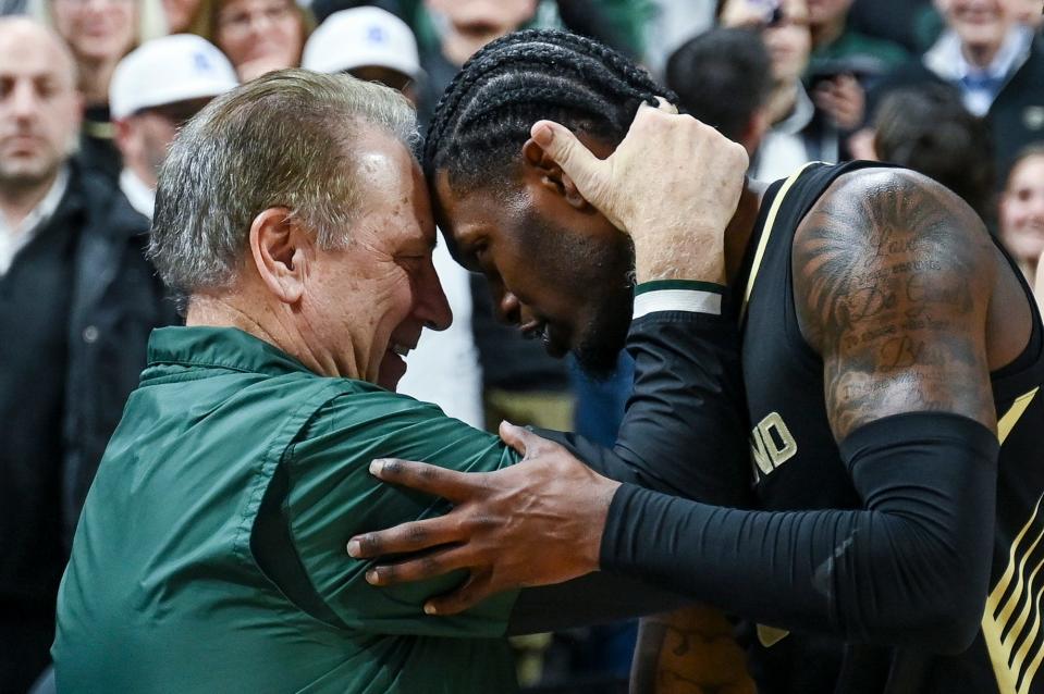 Michigan State's head coach Tom Izzo, left, hugs former player and Oakland's Rocket Watts on Monday, Dec. 18, 2023, at the Breslin Center in East Lansing.