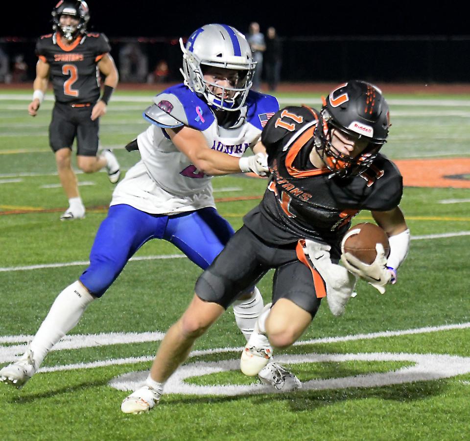 Uxbridge's Liam Rigney breaks away from Auburn's Kaden Wood.