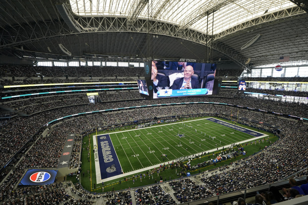 FIFA president Gianni Infantino is shown on the large video screen as the Dallas Cowboys play the New York Jets at AT&T Stadium during an NFL football game in Arlington, Texas, Sunday, Aug. 17, 2023. (AP Photo/Tony Gutierrez)