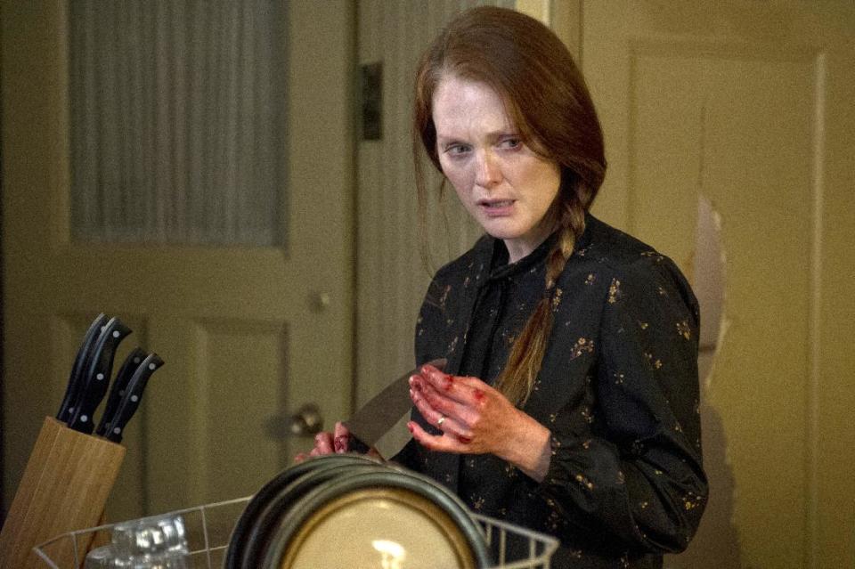 This photo released by Sony Pictures shows Julianne Moore in a scene from the horror film, "Carrie." (AP Photo/Sony Pictures, Michael Gibson)