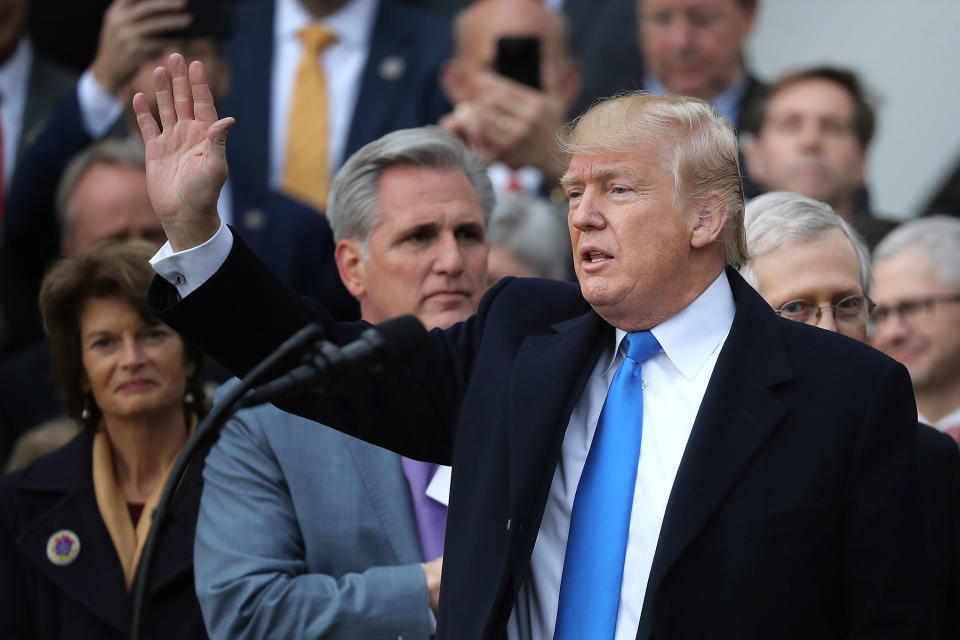 WASHINGTON, DC - DECEMBER 20:  U.S. President Donald Trump waves to guests at the conclusion of an event to celebrate Congress passing the Tax Cuts and Jobs Act on the South Lawn of the White House December 20, 2017 in Washington, DC. The tax bill is the first major legislative victory for the GOP-controlled Congress and Trump since he took office almost one year ago.  (Photo by Chip Somodevilla/Getty Images)