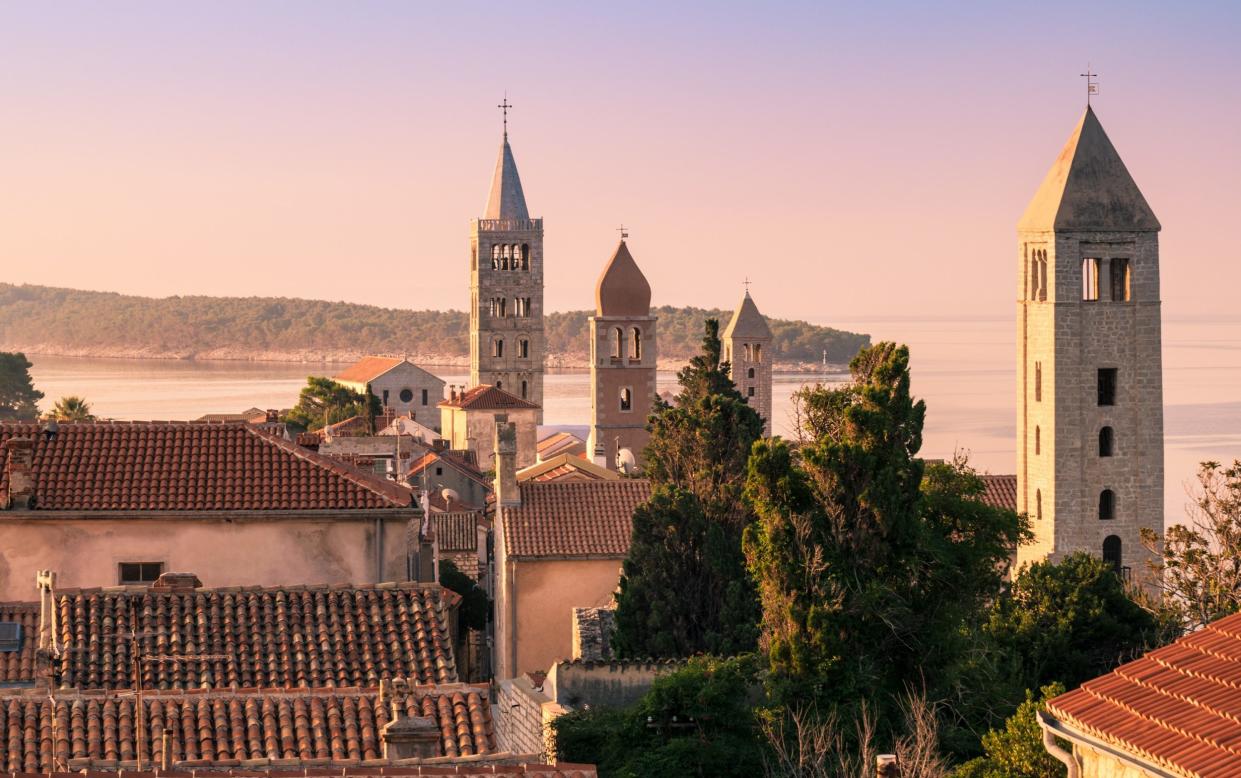 The ancient town on Rab is a jumble of houses and belltowers clustered upon a peninsula