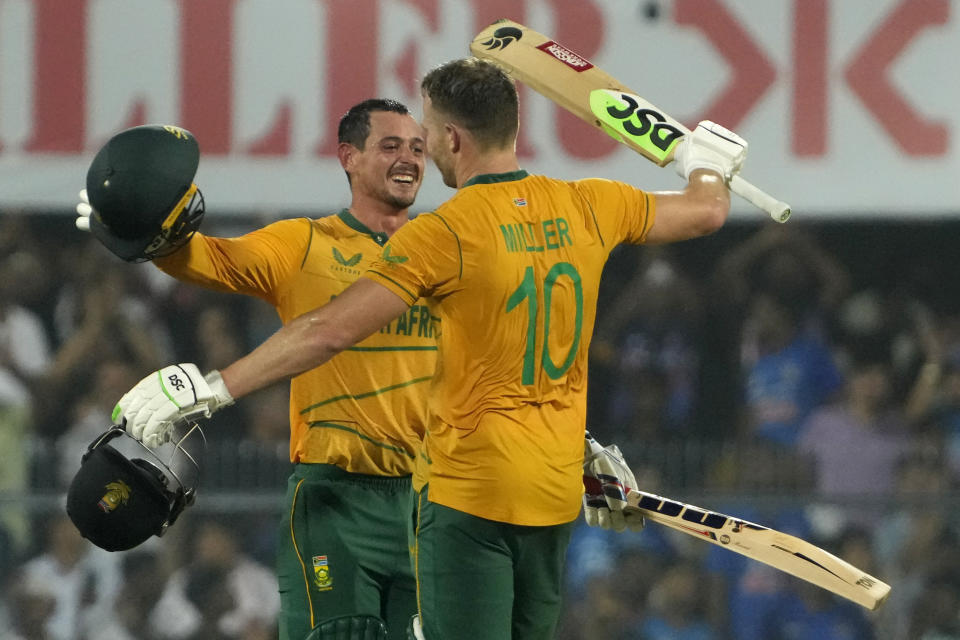 South Africa's David Miller, right, celebrates with batting partner Quinton de Kock after scoring a century during the second T20 cricket match between India and South Africa, in Guwahati, India, Sunday, Oct. 2, 2022. (AP Photo/Anupam Nath)