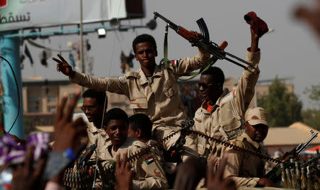 Sudanese soldiers are seen on their vehicles as they move with a military convoy outside the defense ministry compound in Khartoum, Sudan, April 25, 2019. REUTERS/Umit Bektas