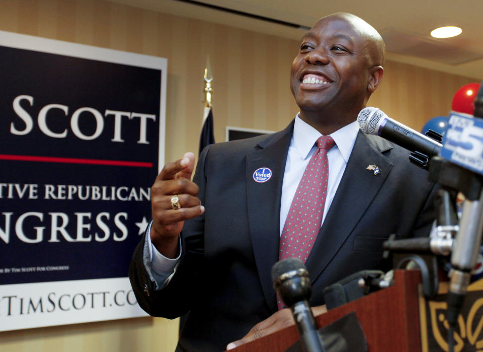 FILE - Rep-elect. Tim Scott, R-S.C., celebrates his victory at his election night party at the Hilton Garden Inn in North Charleston, S.C., Nov. 2, 2010. Scott has filed paperwork to enter the 2024 Republican presidential race. He'll be testing whether a more optimistic vision of America’s future can resonate with GOP voters who have elevated partisan brawlers in recent years. (AP Photo/Alice Keeney, File)