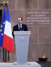 French President Francois Hollande delivers his speech, at the Mont Valerien memorial in Suresnes, West of Paris, Friday Feb. 21, 2014, as part of an homage to French resistance members who fought during World War II, President Francois Hollande says two women who fought with the French Resistance during World War II will be inducted into Paris' renowned Pantheon, the eternal resting place of dozens of French greats.(AP Photo/Remy de la Mauviniere)