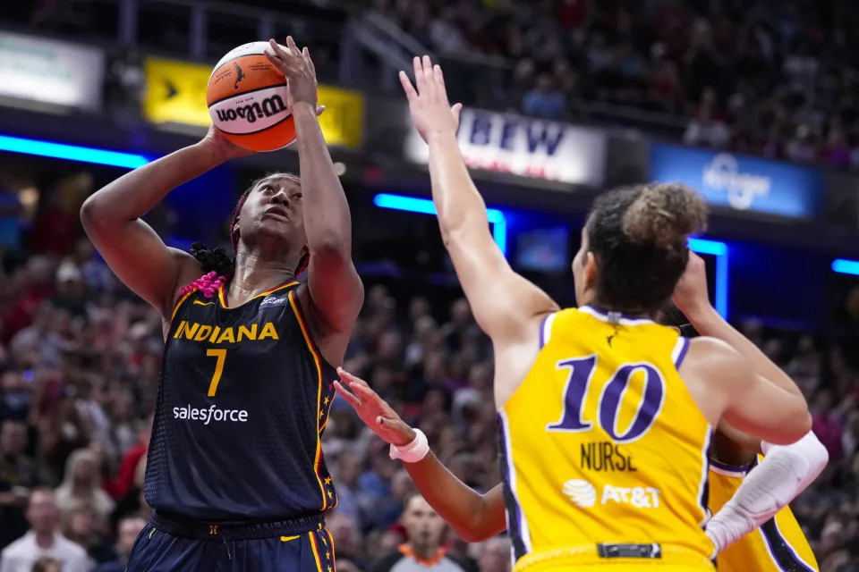 Indiana Fever forward Aliyah Boston (7) shoots over Los Angeles Sparks guard Kia Nurse (10) in the second half of a WNBA basketball game in Indianapolis, Wednesday, Sept. 4, 2024. (AP Photo/Michael Conroy)